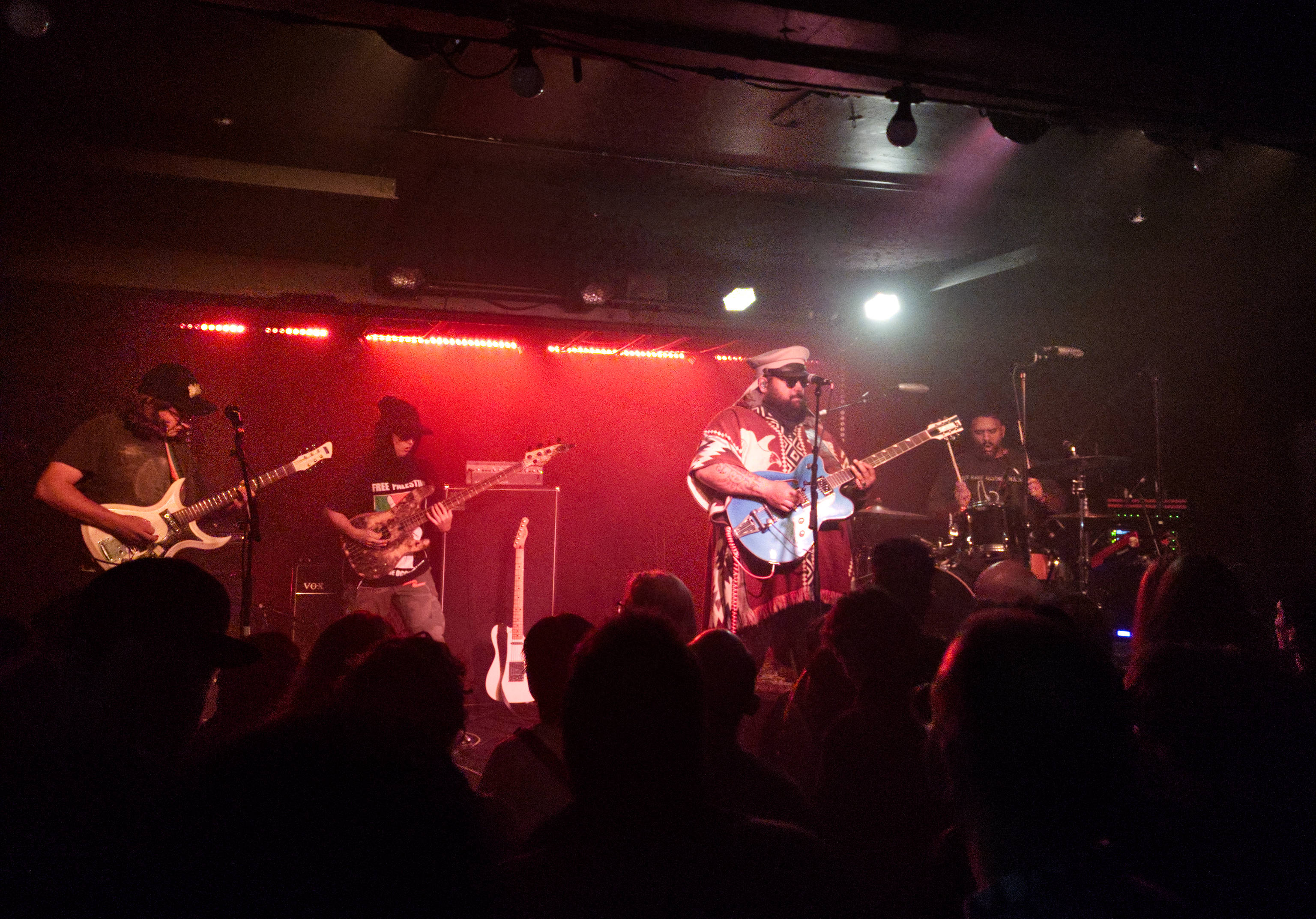 Photo of the band, Troy Kingi, The Cactus Handshake on a stage in a small club